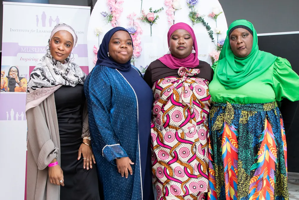 Attendees together in colourful dress